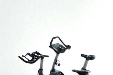 Three exercise bikes in a studio setting