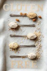 Variety of flours and grains on spoons