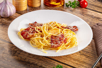Italian classic spaghetti carbonara with bacon and egg