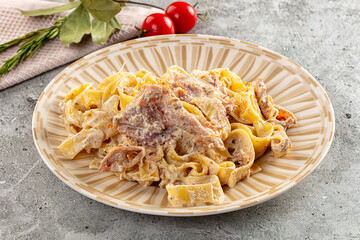 Italian pasta fettuccine with prosciutto