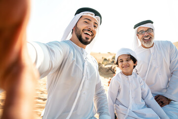 Three generation family making a safari in the desert of Dubai