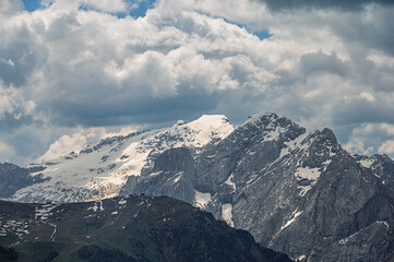 Obraz premium Sella mountain range and Sasso Pordoi images from Col Rodella with a cloudy sky in the background, Dolomites, Italy