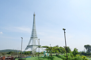 Wide View of Eiffel Tower Replica in Scenic Open Park