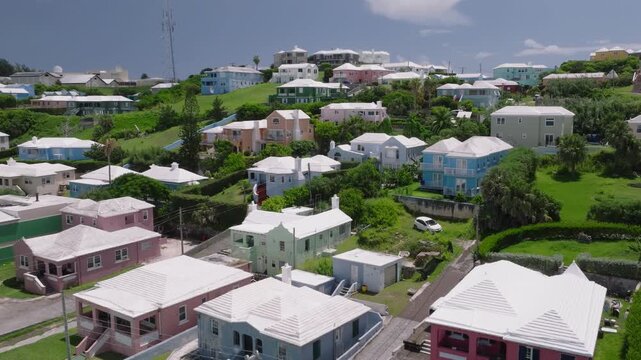 Aerial of the North Shore of Bermuda adorned with its unique colorful houses and whites roofs. video 5
