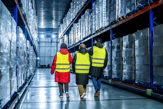 Storage warehouse workers managing cold chain logistics
