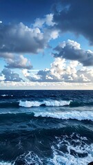 Fototapeta premium Dramatic ocean waves rolling under a cloudy sky