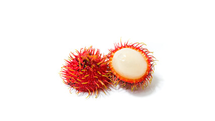 Close-up of fresh tropical rambutan fruit with bright red hairy skin and juicy white flesh, half peeled and isolated on a clean white background