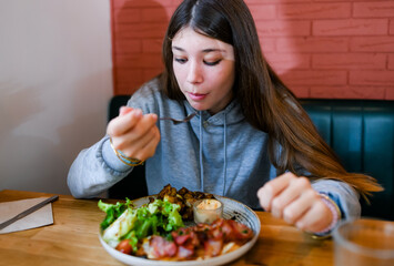 A varied plate of meat, ham, salad, coriander, and burratta