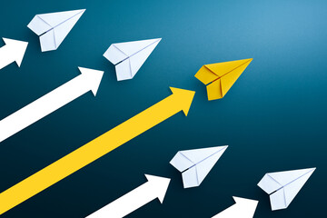 Business competition concept. Yellow paper plane and arrow up