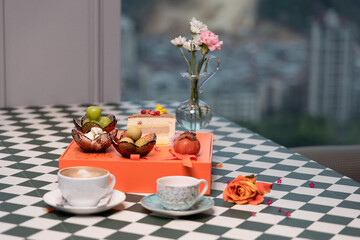 Exquisite Afternoon Tea Desserts and Floral Tea, Modern Minimalist Style, High-Rise City Restaurant