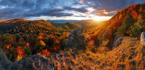 Aerial view of a mountains and hills landscape with vineyard and countryside at sunset in autumn...