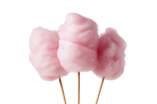 Three pink cotton candy sticks isolated on black