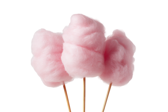 Three pink cotton candy sticks isolated on black