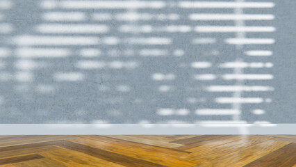 Empty room with sunlight streaming through blinds onto concrete wall