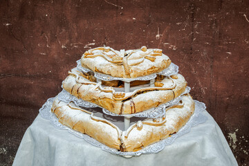 Large three-tier heart-shaped apple strudel prepared for a wedding party.