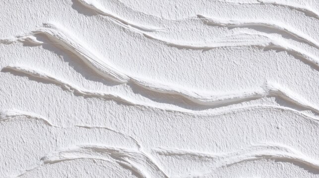 Textured wall displays dynamic wave like patterns capturing light beautifully and creating depth.