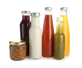 Bottles with different tasty sauces isolated on white