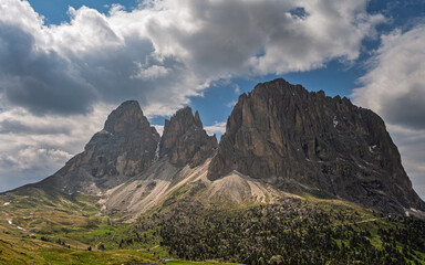 Sasso Lungo mountain range images with a cloudy sky in the background, Val di fassa, Dolomites, Italy