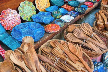  Wooden spoons and ceramic dishes in souvenir shop. Kruje Albania.