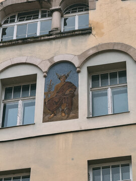 Hermes caduceus mosaic on building facade architecture