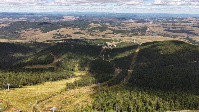 Zlatibor Mountain, Serbia. Ski Tracks and Gondola Station on Tornik Peak on Sunny Day, Drone Aerial View