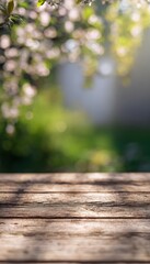 Warm spring glow  close up of wooden planks with blurred blossoms and lush greenery background