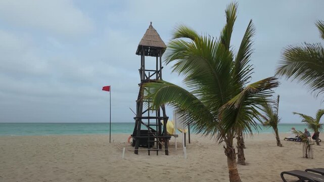 Lifeguard tower with a red flag flying on the beach at Boa Vista, Cape Verde.