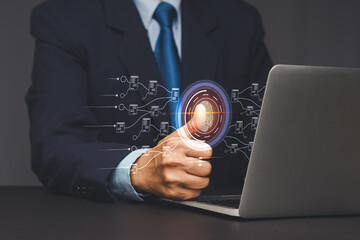Businessman using fingerprint scan for digital security access.