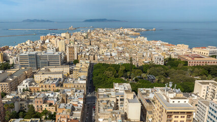 Aerial view of houses and buildings in the historic center of Trapani, Sicily, Italy. It is a beautiful city overlooking the Mediterranean Sea. The Aegadian Islands are in the background.