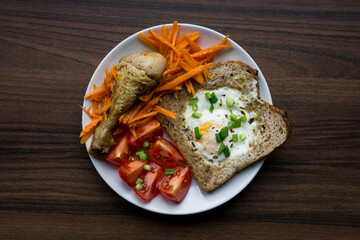 Breakfast with egg toast, chicken and carrot salad