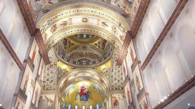 Interior of the People&rsquo;s Salvation Cathedral in Bucharest, Romania. Majestic Orthodox cathedral with grand arches, golden mosaics, marble columns, and intricate religious frescoes