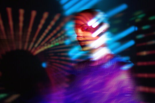 Surreal neon portrait with motion blur and cyberspace fantasy concept