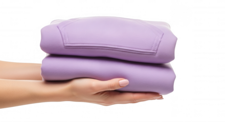 Folded lavender fabric held by hands isolated on a transparent background