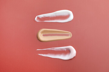 Samples of cosmetic product on color background, flat lay