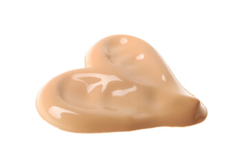 Heart made of foundation isolated on white. Cosmetic product