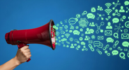 Hand holding a red megaphone, with social media icons emitting from it, representing communication, broadcasting, and digital marketing strategy