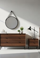 Modern walnut dresser and nightstand with a round mirror and black desk lamp, creating a stylish bedroom vignette