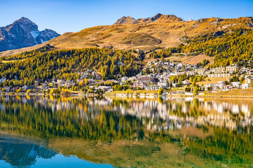 The village and lake of St. Moritz in autumn, with the trees turning color. Engadine, Switzerland.