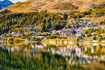 The village and lake of St. Moritz in autumn, with the trees turning color. Engadine, Switzerland.