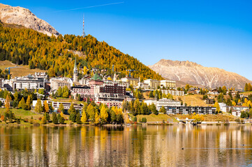 The village and lake of St. Moritz in autumn, with the trees turning color. Engadine, Switzerland.