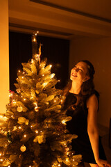 girl at the New Year tree