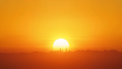 Bright orange sunset over city skyline and mountains