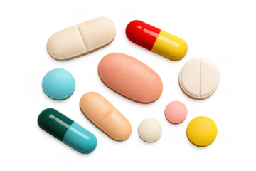 Medicine pills and capsules of various colors, shapes, and sizes on transparent background, healthcare concept