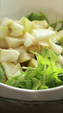 fall pear salad with blue cheese preparation close up