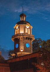 Historical clock tower in the city center of Varna, Bulgaria during blue hour after suumer sunset