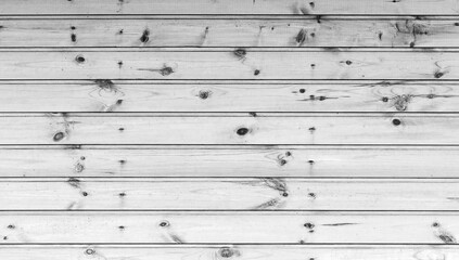 Wooden panels form a white textured surface, showcasing natural grains