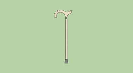 Beige cane with curved handle on a light green background
