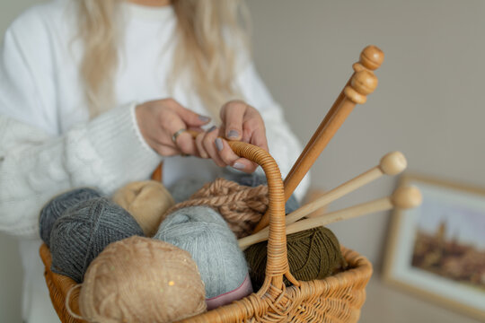 a backet of knitting tools