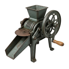 An antique, metallic machine, likely for processing grains or seeds. Its aged surface and hand-crank suggest vintage use and mechanical function