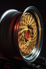 old retro stylish wheels collapsible two-component with a gold center and shiny rims for car tuning long exposure photo to simulate movement
